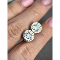 Срібні сережки в стилі Bvlgari закрутки з одним каменем посередині